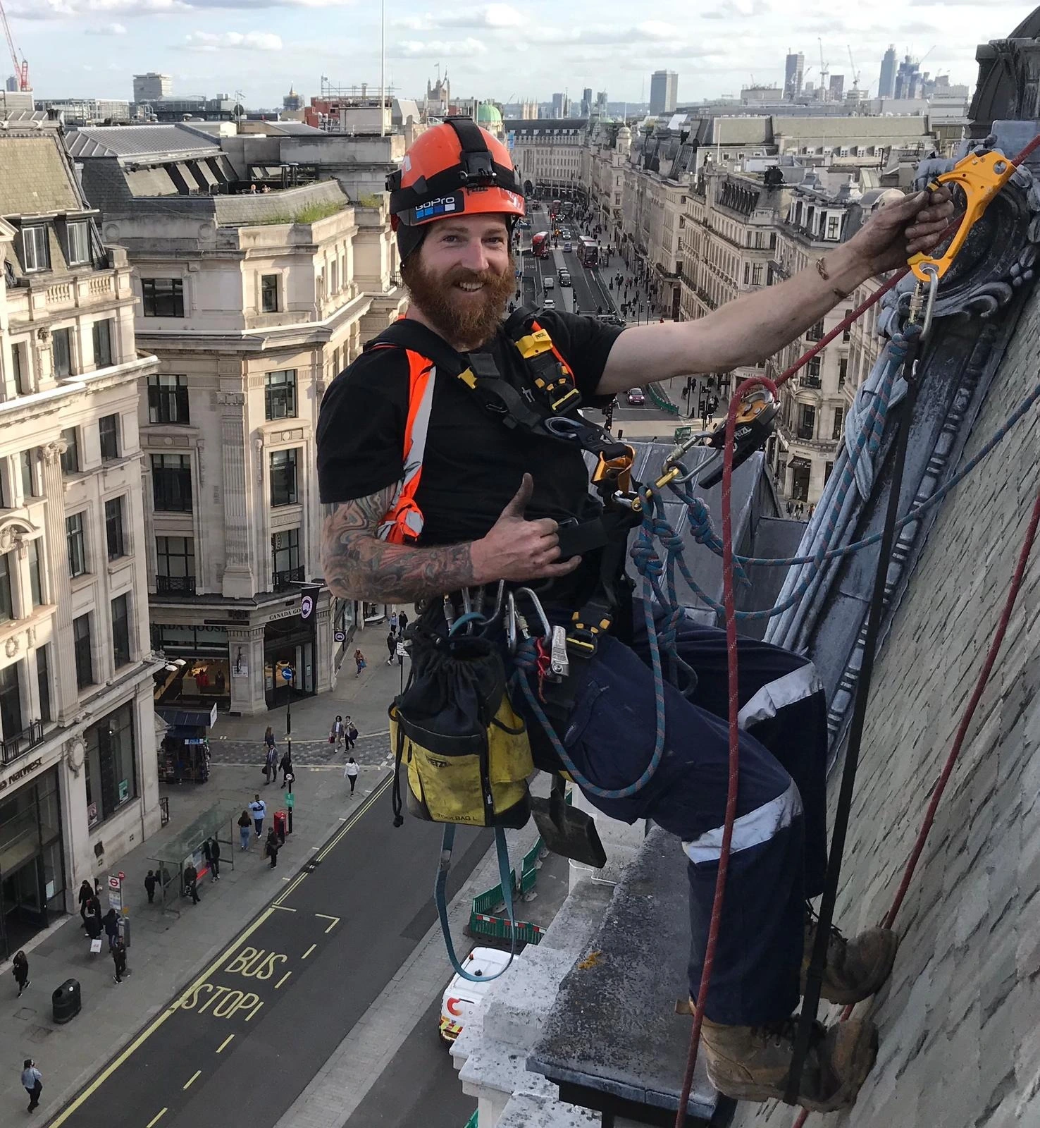 Rope access technicians carrying out bird proofing on a high rise building in London to prevent bird nesting